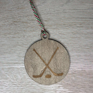 Hockey stick with puck ornament