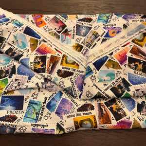 Disney 100 Years of Wonder Postage Stamp fabric - by the 1/4 yard