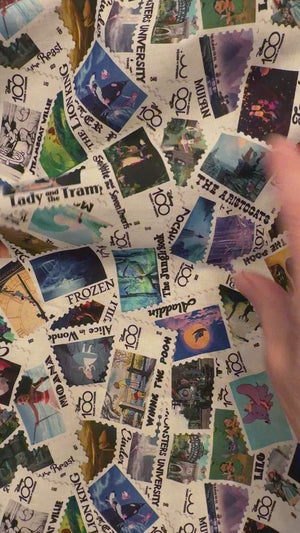 Disney 100 Years of Wonder Postage Stamp fabric - by the 1/4 yard